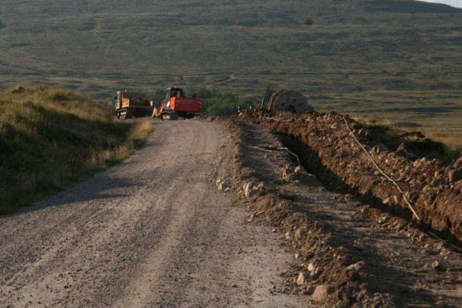 Pro-Tech crew member alongside utility installation equipment